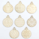 Unfinished wood ornament craft set with eight pale bauble shapes arranged on white, featuring stars, stripes, trees, circles, and a snowflake.