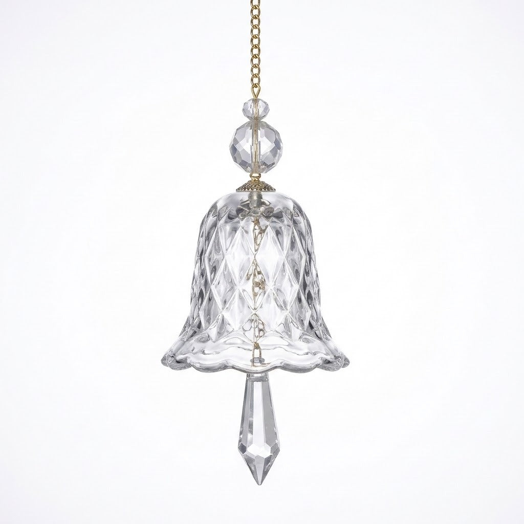 A clear bell-shaped glass suncatcher with diamond-patterned sides, two faceted beads, and a pointed drop hangs against a white background.