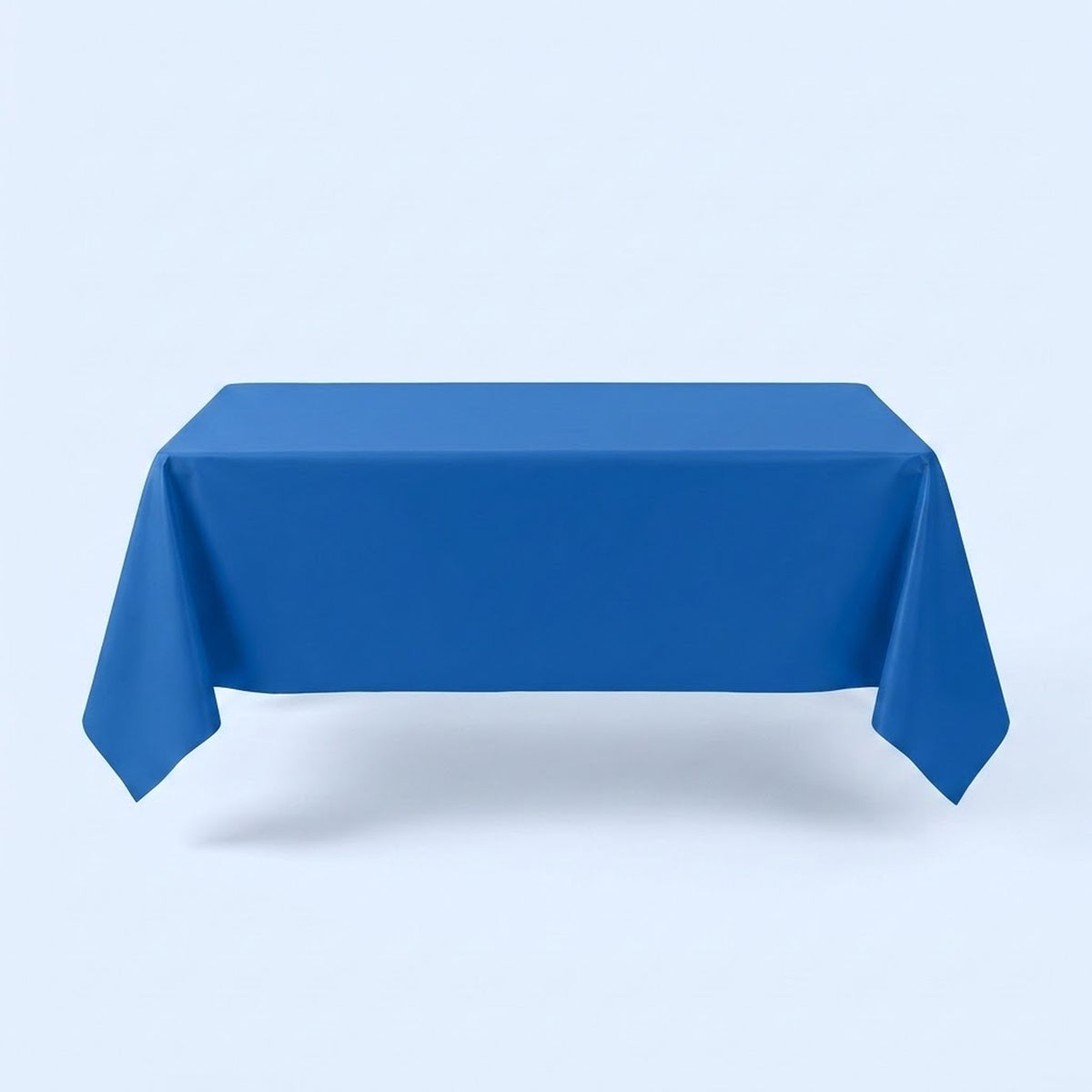 A blue tablecloth covers a rectangular table with hanging corners against a pale blue background.