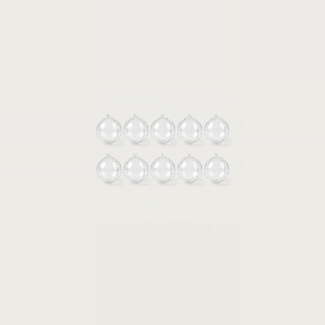 Ten clear plastic fillable ornaments form two compact rows of five, centered within a wide off-white background.
