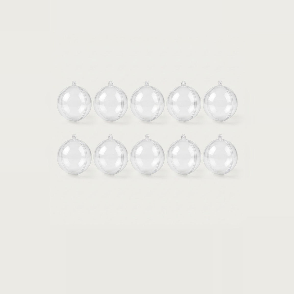 Ten clear plastic fillable ornaments with top hanging loops form two evenly spaced rows of five against an off-white background.