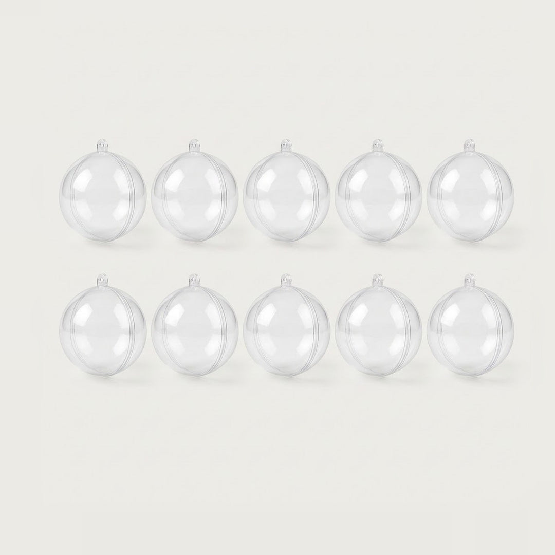 Ten clear plastic fillable ornaments with hanging loops and visible seams form two rows of five against an off-white background.