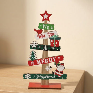 Wooden tabletop Christmas decoration with red and green message slats and a red star topper stands on a light wood surface.