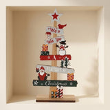 Wooden tabletop Christmas decoration with red, green and white message slats and a star topper stands inside a cream wall niche.