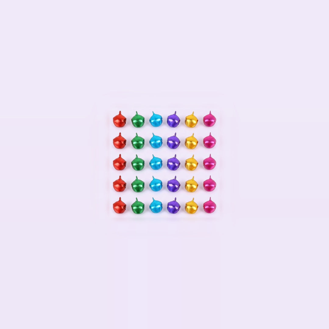 Thirty tiny metallic jingle bells in six colors form a compact grid with generous pale space around them.