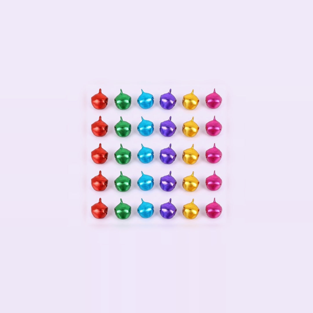 Thirty colorful metallic jingle bells with hanging loops form a centered grid surrounded by a wide pale background.