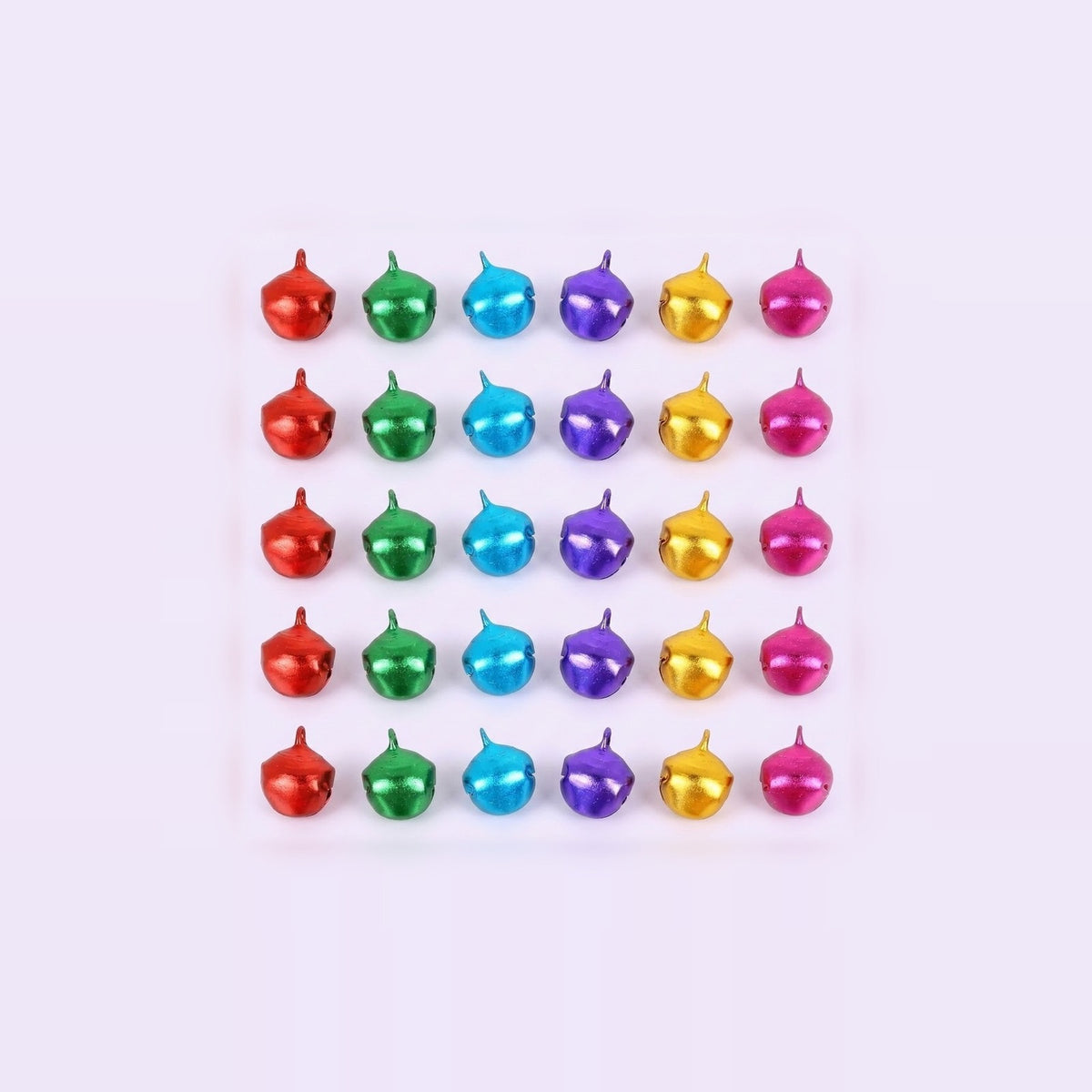 Red, green, blue, purple, gold, and pink metallic jingle bells sit in five rows of six on a pale background.