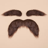 Brown costume facial hair set with two eyebrows above a thick, drooping mustache on a pale peach background.