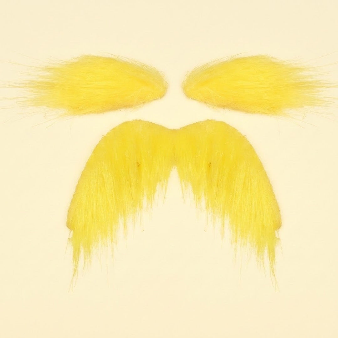 Yellow costume facial hair set with two eyebrows above a matching drooping mustache on a pale cream background.