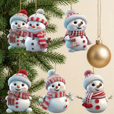 Six white acrylic snowman Christmas ornaments with red-and-white hats and scarves hang beside evergreen branches and a gold bauble against a cream background.