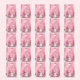 Pink handled gift bags with snowmen, Christmas trees, and Merry Christmas lettering form a five-by-five grid against a pale pink background.