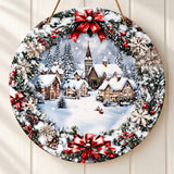 Round wood Christmas sign hangs against cream paneling, displaying flat snowy village artwork bordered by printed greenery, red bows, and snowflakes.