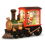 Red and green plastic Christmas train decoration has gold trim, black wheels, and an illuminated Santa compartment against a white background.
