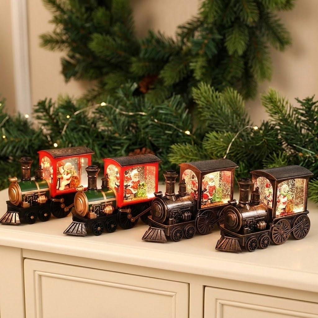 Four illuminated Christmas train decorations in red, green, and bronze tones on a cream cabinet beneath evergreen garland.