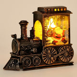 Bronze-tone plastic Christmas train decoration features a yellow-lit Santa illustration and detailed wheels against a beige background.