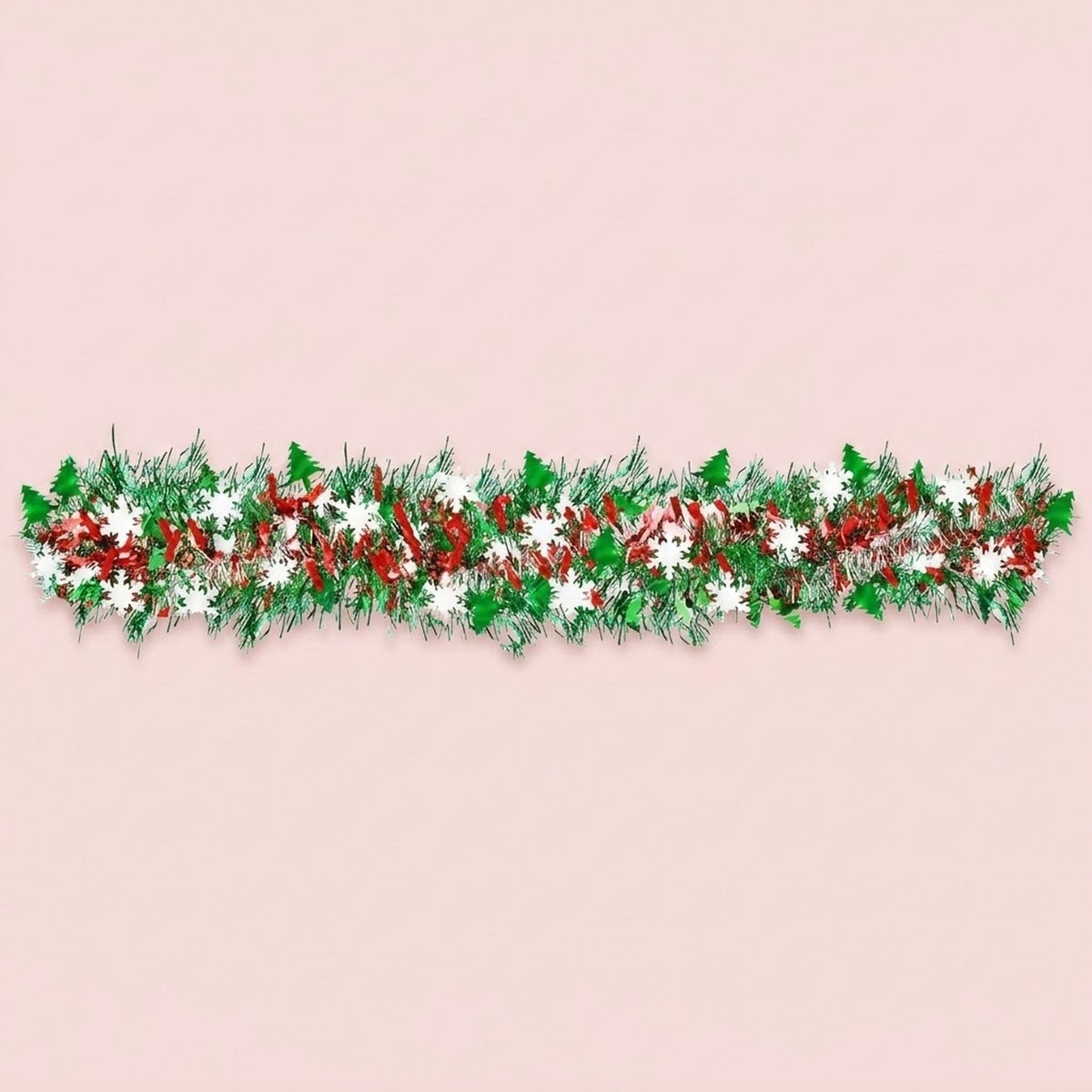 Green, red, and silver tinsel garland with green tree shapes and white snowflakes stretches horizontally across a pale pink background.