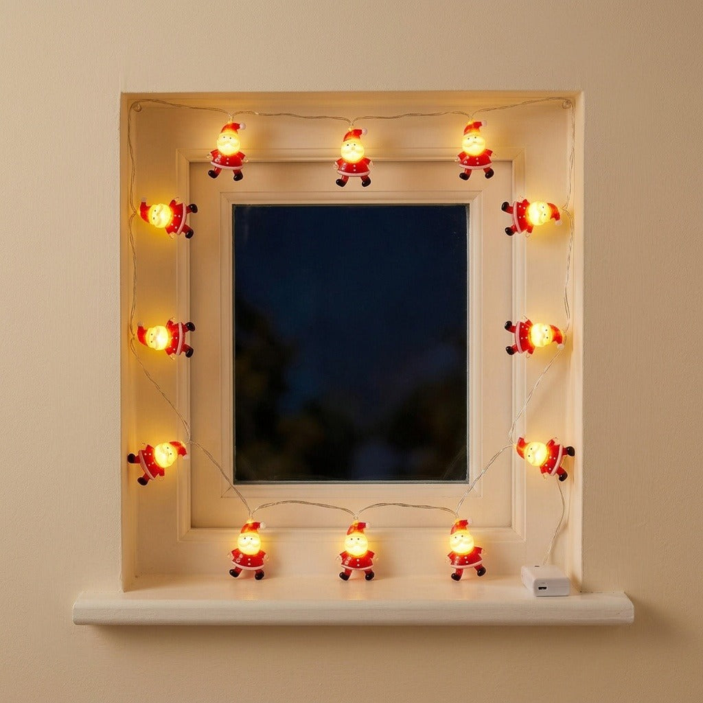 Glowing red Santa string lights frame a white window at night, with a small white control box on the sill.