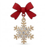 A red bow earring with a gold-tone snowflake drop and round clear stones stands against a white background.