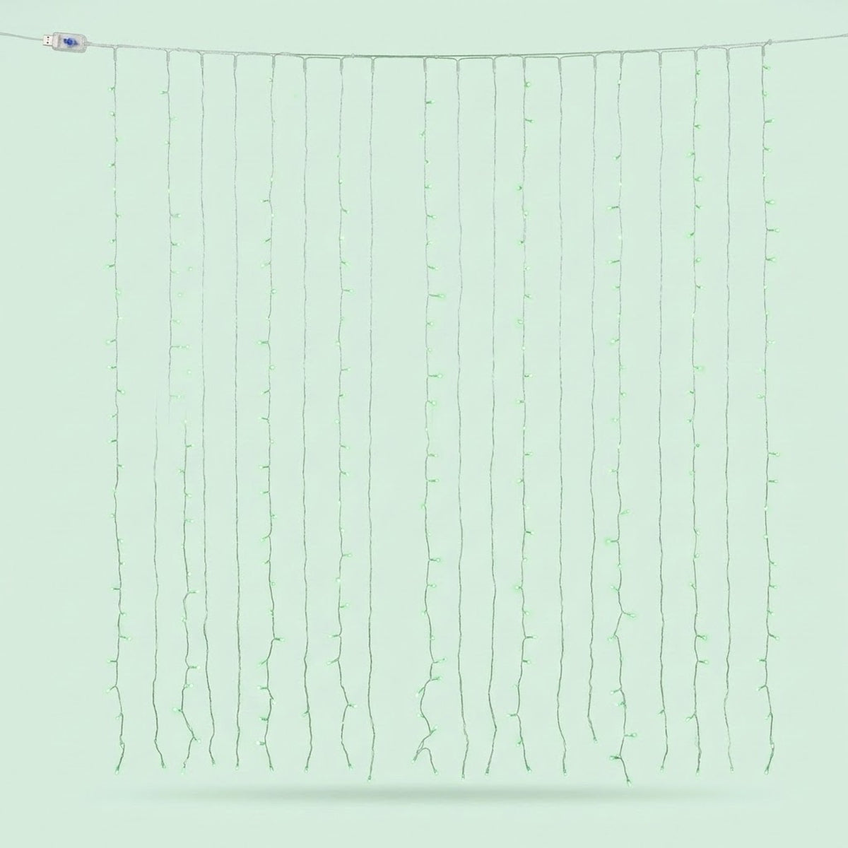 Green curtain lights hang in vertical strands against a pale green background, with a USB connector at the upper left.
