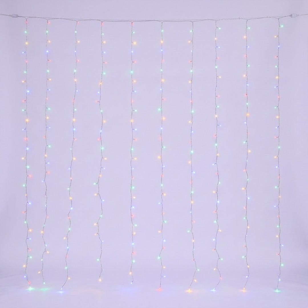 Multicolored curtain lights glow along clear hanging strands against a pale background.