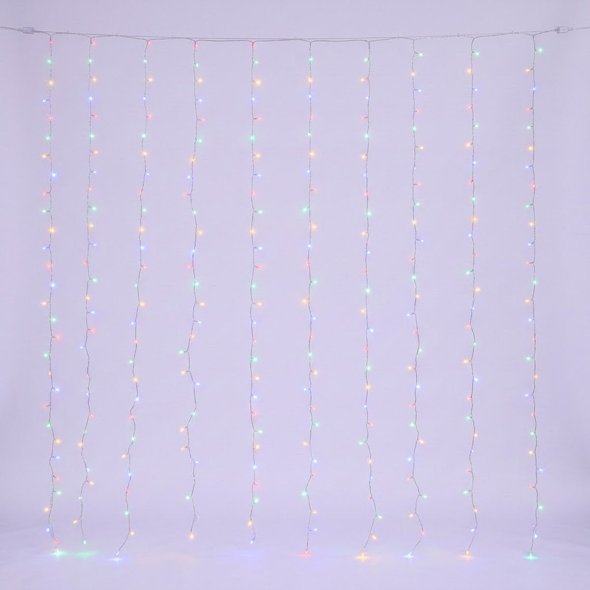 Multicolored curtain lights glow along clear hanging strands against a pale background.