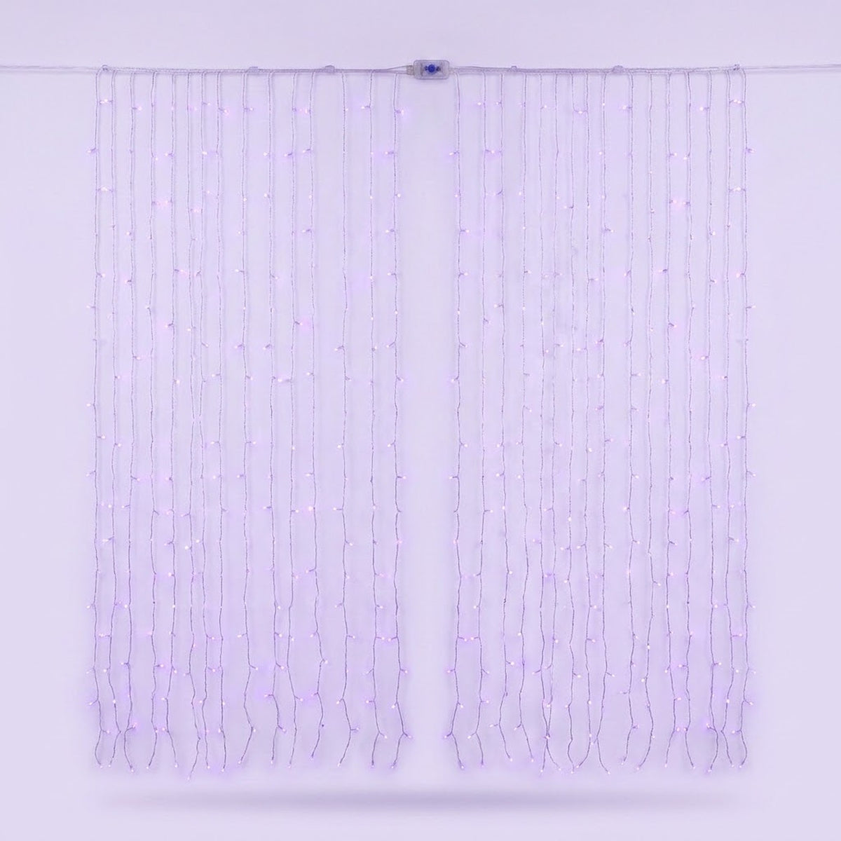 Pale purple curtain lights hang on clear wires against a lavender background, with a small connector along the top cable.