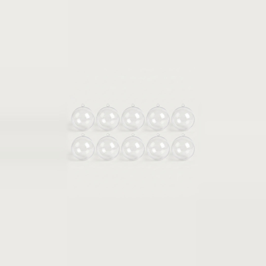 Ten clear plastic fillable ornaments cluster in two rows of five at the center of a white background.