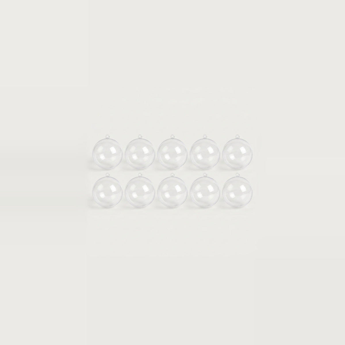 Ten clear plastic fillable ornaments cluster in two rows of five at the center of a white background.