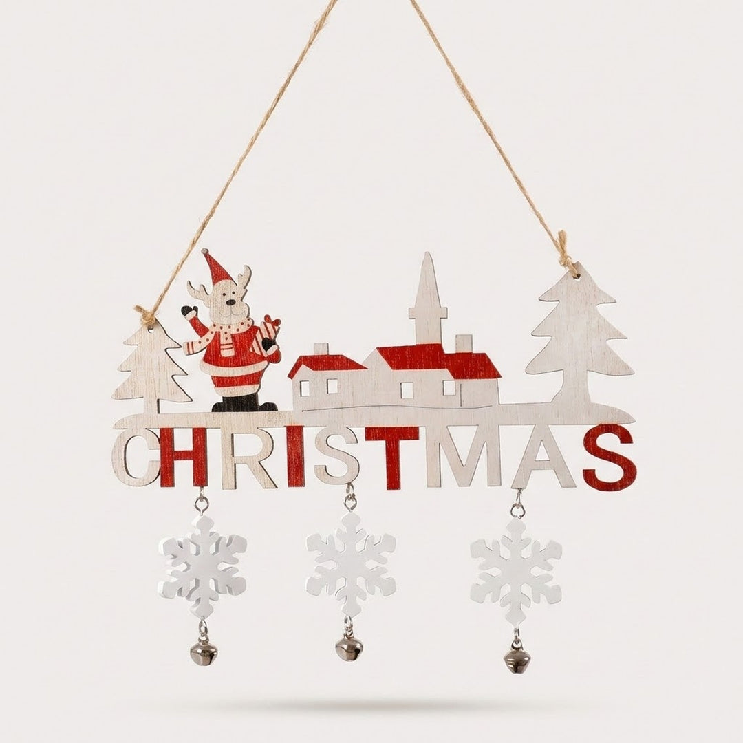 Red and white wooden Christmas ornament spelling CHRISTMAS, with a Santa figure, village houses and three dangling snowflakes with bells, on a light background