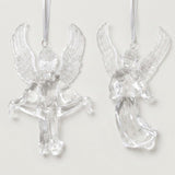 Two clear acrylic angel Christmas ornaments with raised textured wings hang from white ribbons against a white background.