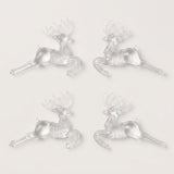 Four clear acrylic leaping reindeer Christmas ornaments with antlers are arranged in two inward-facing pairs against a white background.