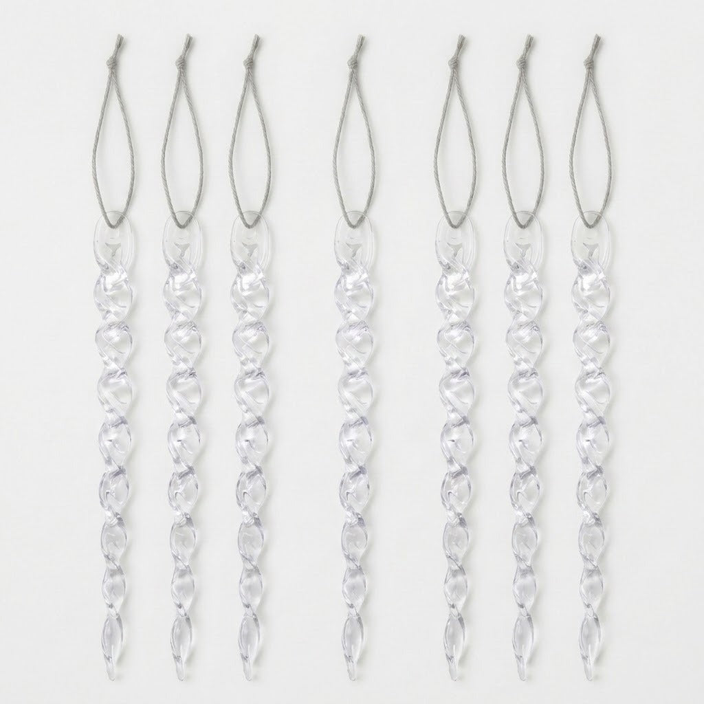 Seven clear spiral icicle ornaments with silver hanging loops are arranged vertically against a plain white background.