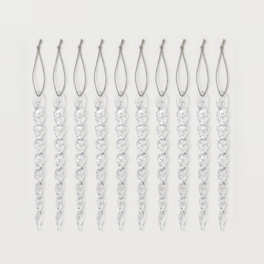 Ten clear twisted icicle ornaments with silver hanging loops form an evenly spaced row against a white background.