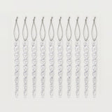 Ten clear twisted icicle ornaments with silver hanging loops form an evenly spaced row against a white background.
