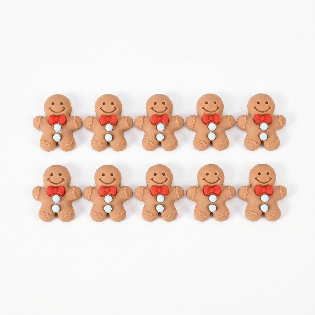 Ten brown resin gingerbread craft embellishments with red bows and pale blue buttons form two rows on a white background.