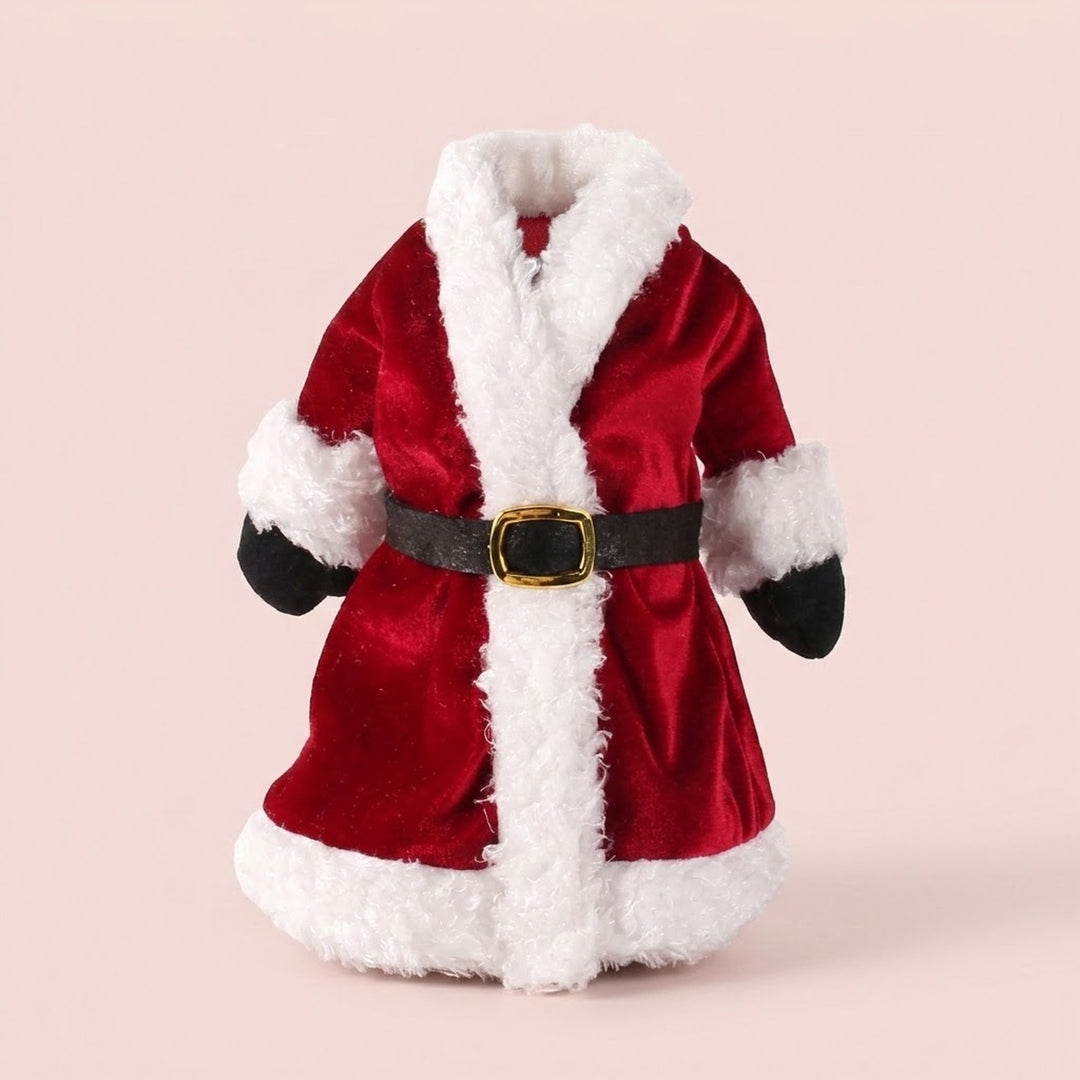 Red Santa coat wine bottle cover with fluffy white trim, black mittens and a gold-buckled belt against a pale pink background.