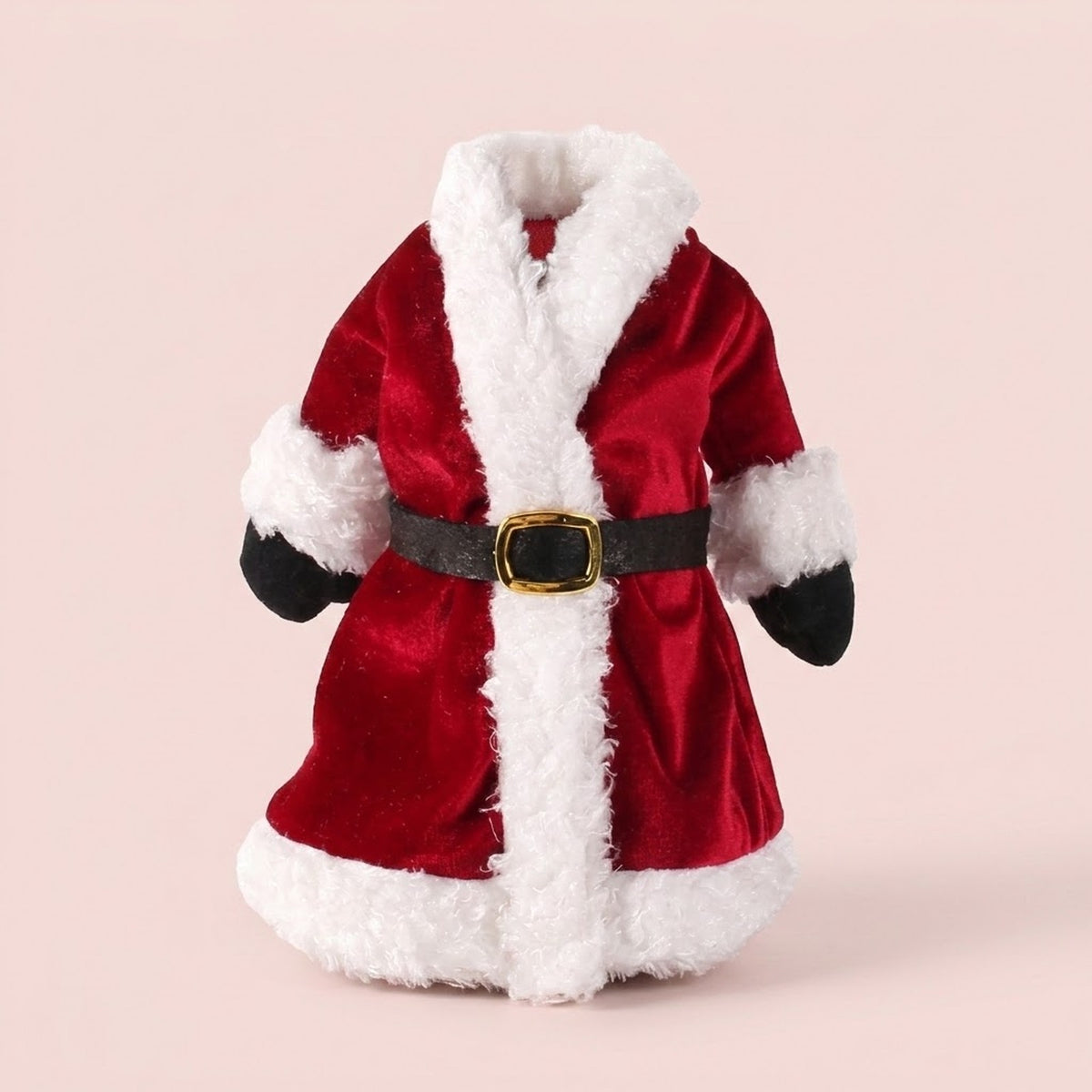Red Santa coat wine bottle cover with fluffy white trim, black mittens and a gold-buckled belt against a pale pink background.
