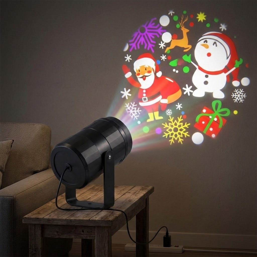 Black Christmas light projector sits on a rustic wooden table beside a sofa, projecting Santa, a snowman, reindeer, snowflakes, and a gift.