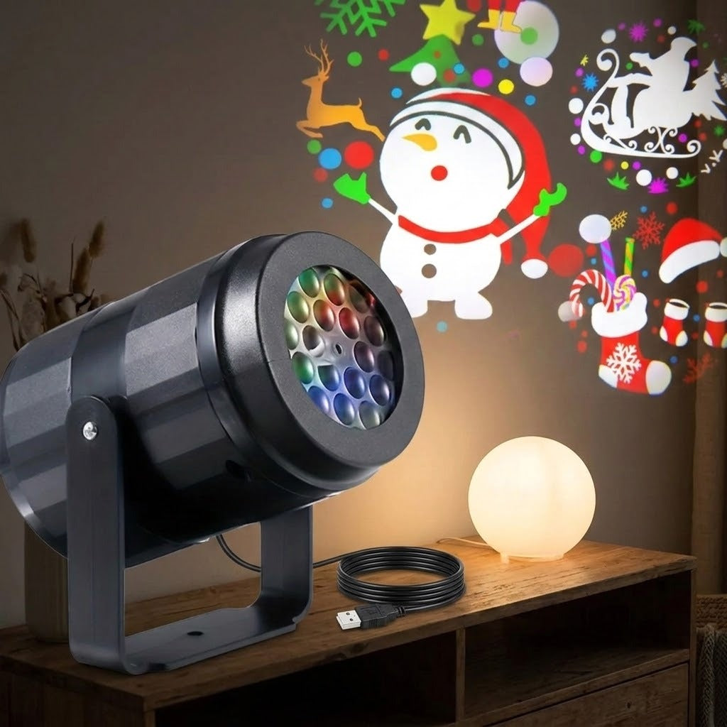 Black Christmas light projector and coiled USB cable sit on a wooden cabinet beside a glowing globe lamp, beneath colorful snowman and sleigh projections.