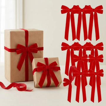 Set of twelve red velvet Christmas bows beside two kraft-paper gift boxes tied with matching bows on a cream background.