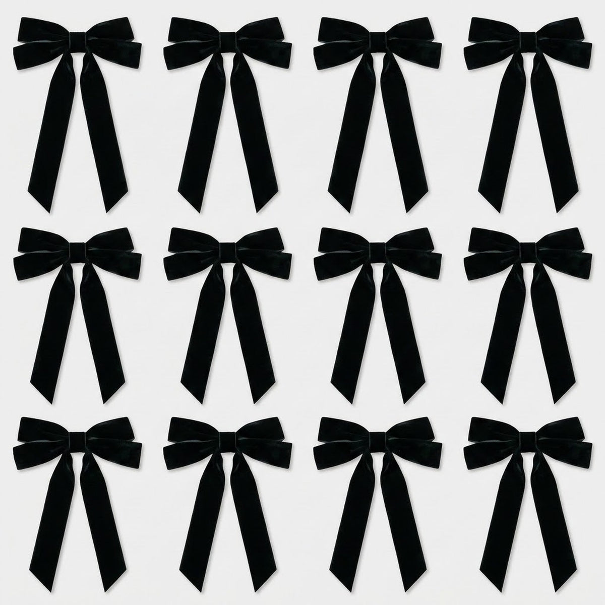Twelve black velvet Christmas bows with long angled tails are arranged in three rows of four on a light gray background.