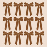 Twelve brown velvet Christmas bows with long angled tails are arranged in three rows of four on a pale beige background.