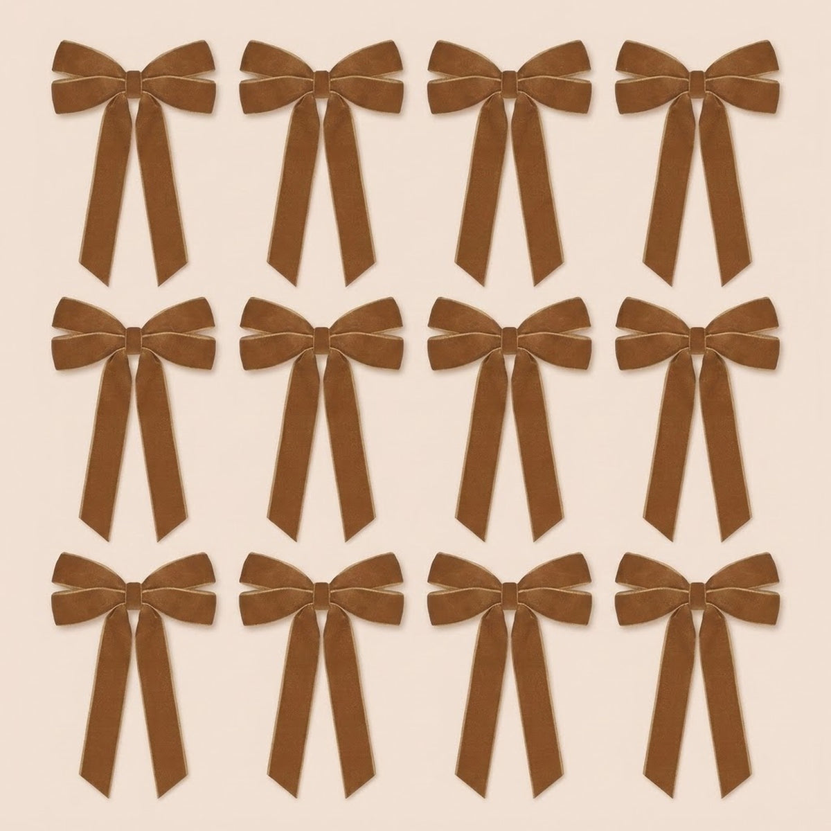 Twelve brown velvet Christmas bows with long angled tails are arranged in three rows of four on a pale beige background.
