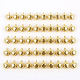 Fifty gold-color jingle bells with hanging loops are arranged in five rows of ten on a white background.