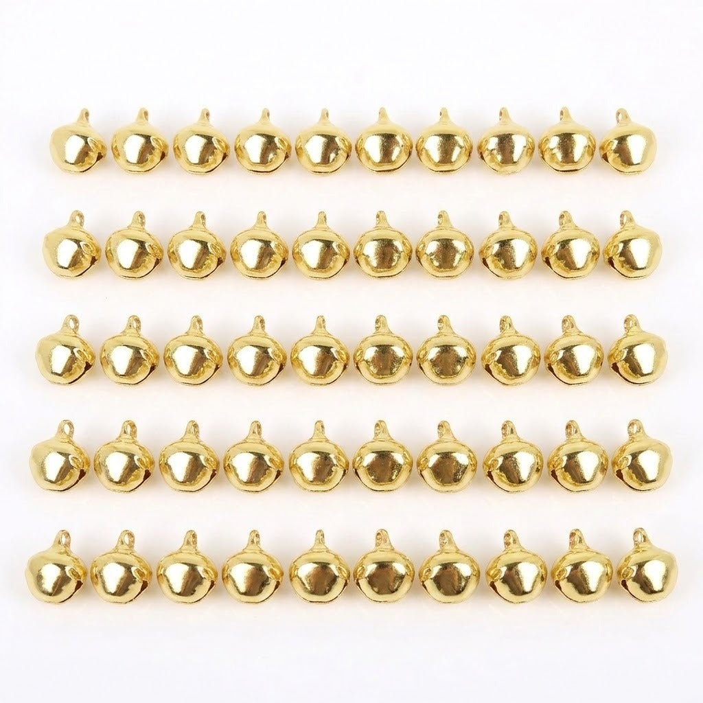 Fifty gold-color jingle bells with hanging loops are arranged in five rows of ten on a white background.
