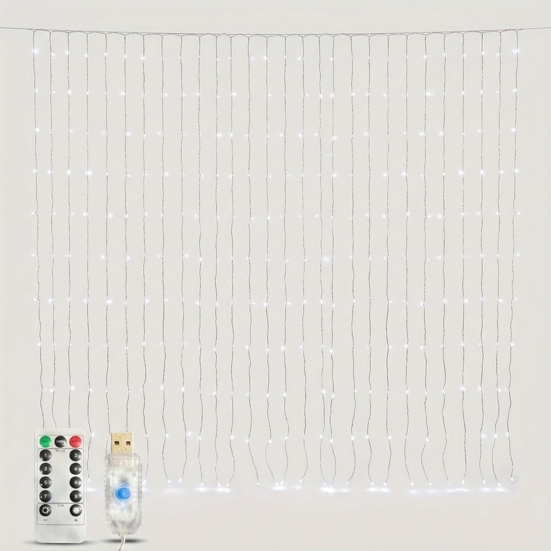 Lit cool white LED curtain string light strands with a remote control and USB power plug against a plain light grey background.