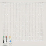 Lit cool white LED curtain string light strands with a remote control and USB power plug against a plain light grey background.