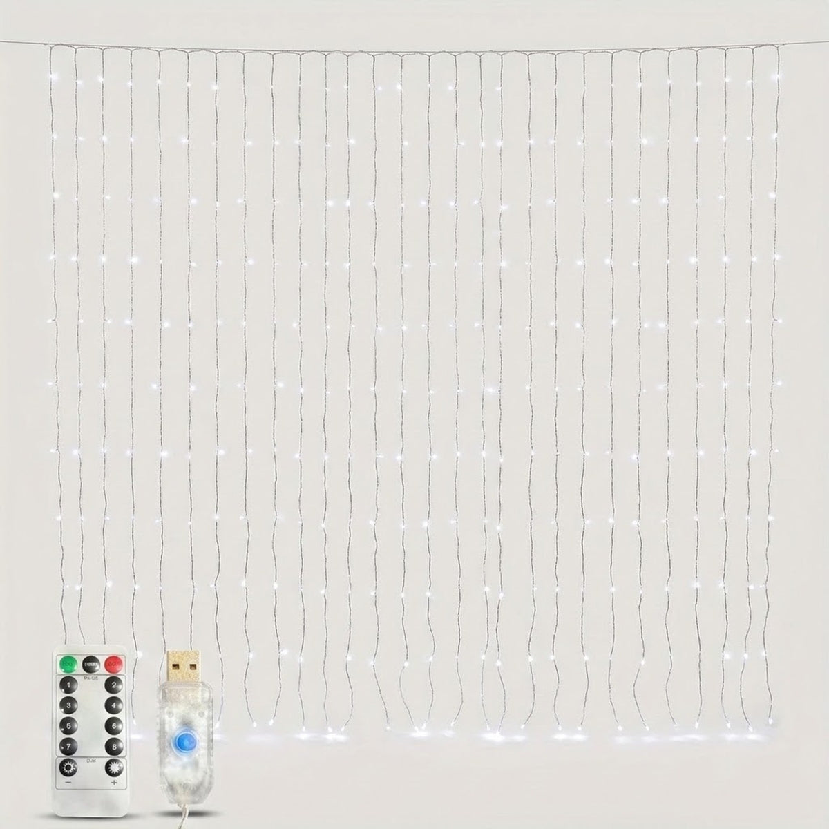 Lit cool white LED curtain string light strands with a remote control and USB power plug against a plain light grey background.
