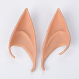 A matching pair of peach latex elf ears lies side by side on a plain white background.