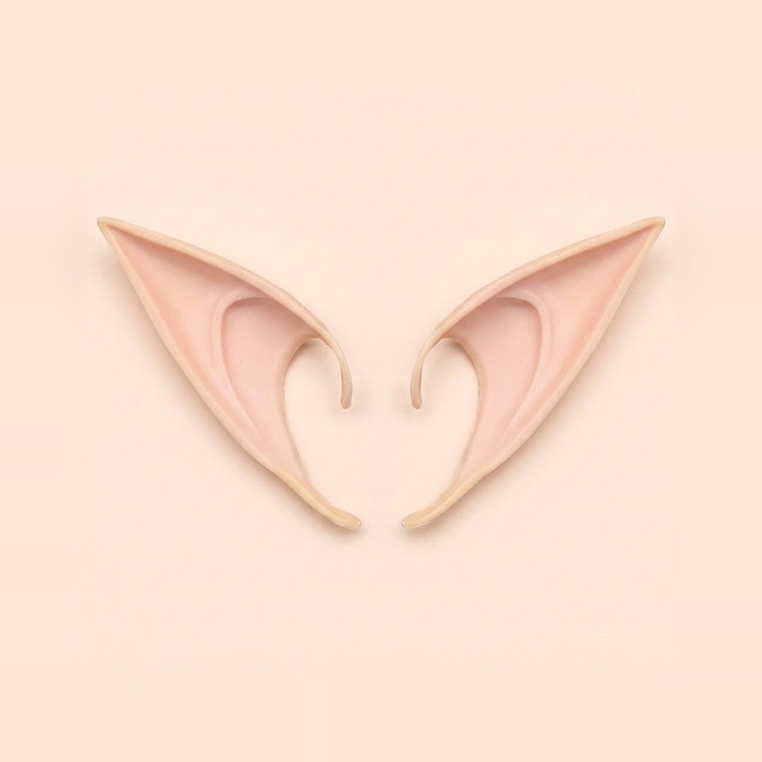 Light peach latex elf costume ears with curved hooks lying side by side on a pale peach background, 4.72 in (12 cm) pair.